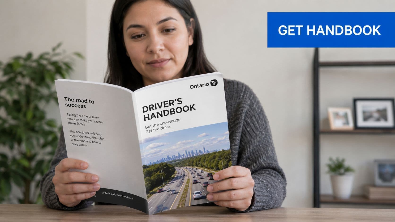 A person reading the official Ontario Driver's Handbook to prepare for their driving test.