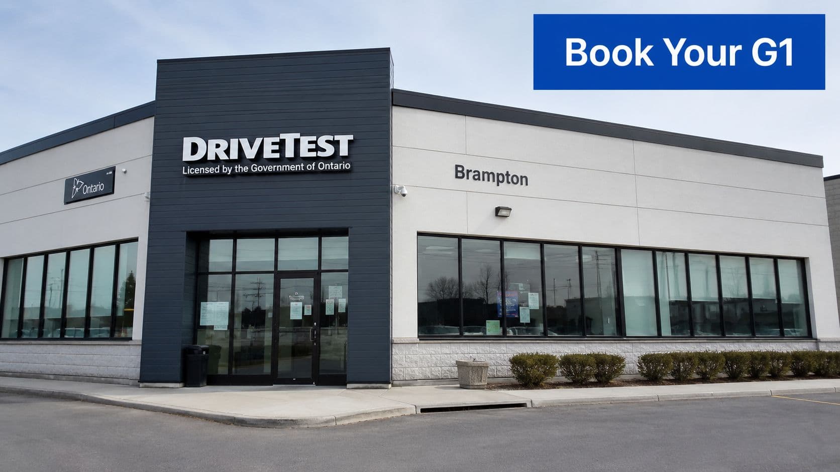 A modern DriveTest center building located in Brampton, Ontario, under a clear blue sky.