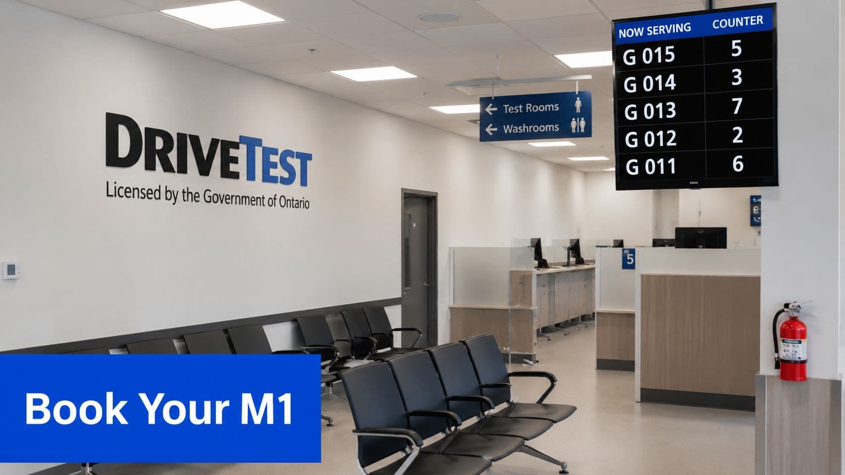 Waiting room inside a DriveTest centre with a digital display showing current ticket numbers and counters.